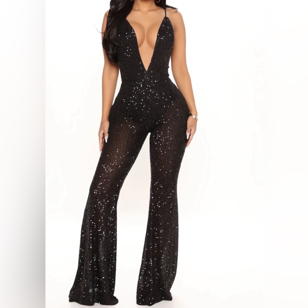 Sequin jumpsuit.NEVER WORN. Tag size small but it was tagged wrong. It is a XS.